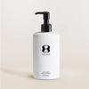 White bottle with black pump and 'One Skin' logo on a beige background