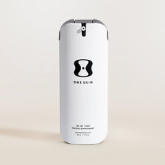 Skincare bottle labeled 'One Skin' on a beige background